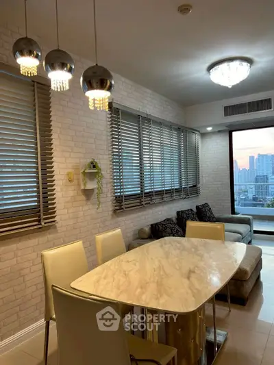 Modern dining area with city view and stylish lighting