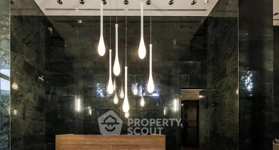 Luxurious modern lobby with elegant lighting and sleek marble walls