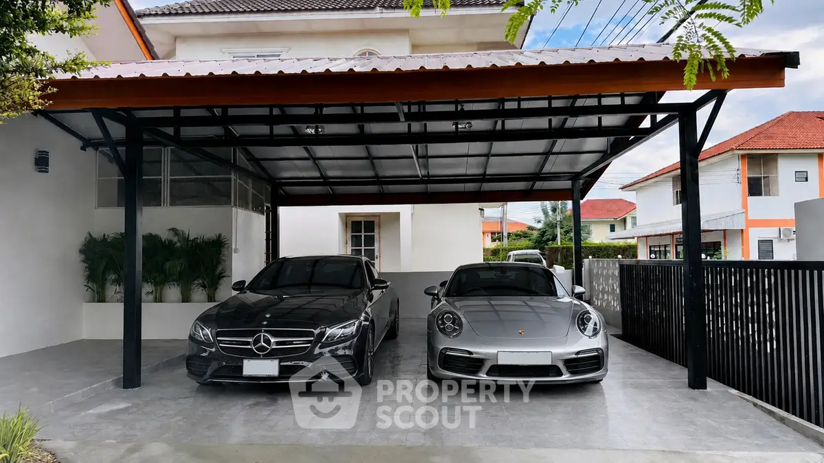 Modern carport with luxury cars in a stylish residential property
