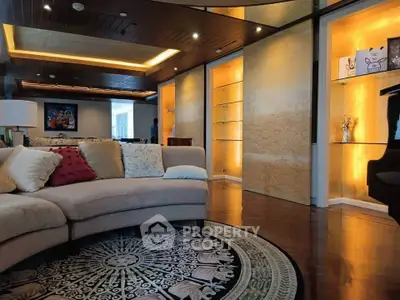 Luxurious living room with elegant lighting and plush seating in a modern apartment.
