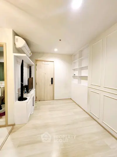 Modern minimalist living room with built-in shelves and air conditioning