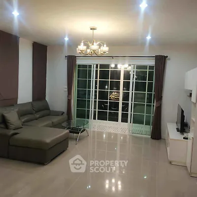 Spacious modern living room with sleek furniture and elegant lighting