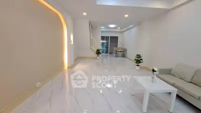 Spacious modern living room with elegant lighting and sleek marble flooring