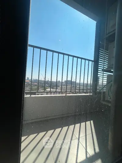 Spacious balcony with panoramic city view and ample sunlight