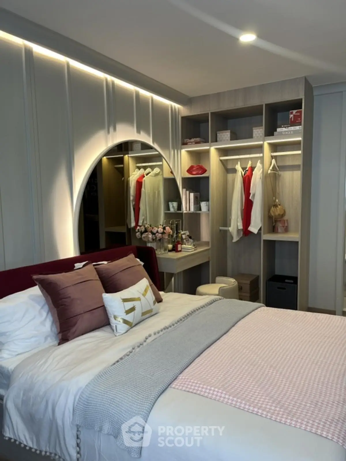 Luxurious bedroom with elegant decor and built-in closet in modern apartment