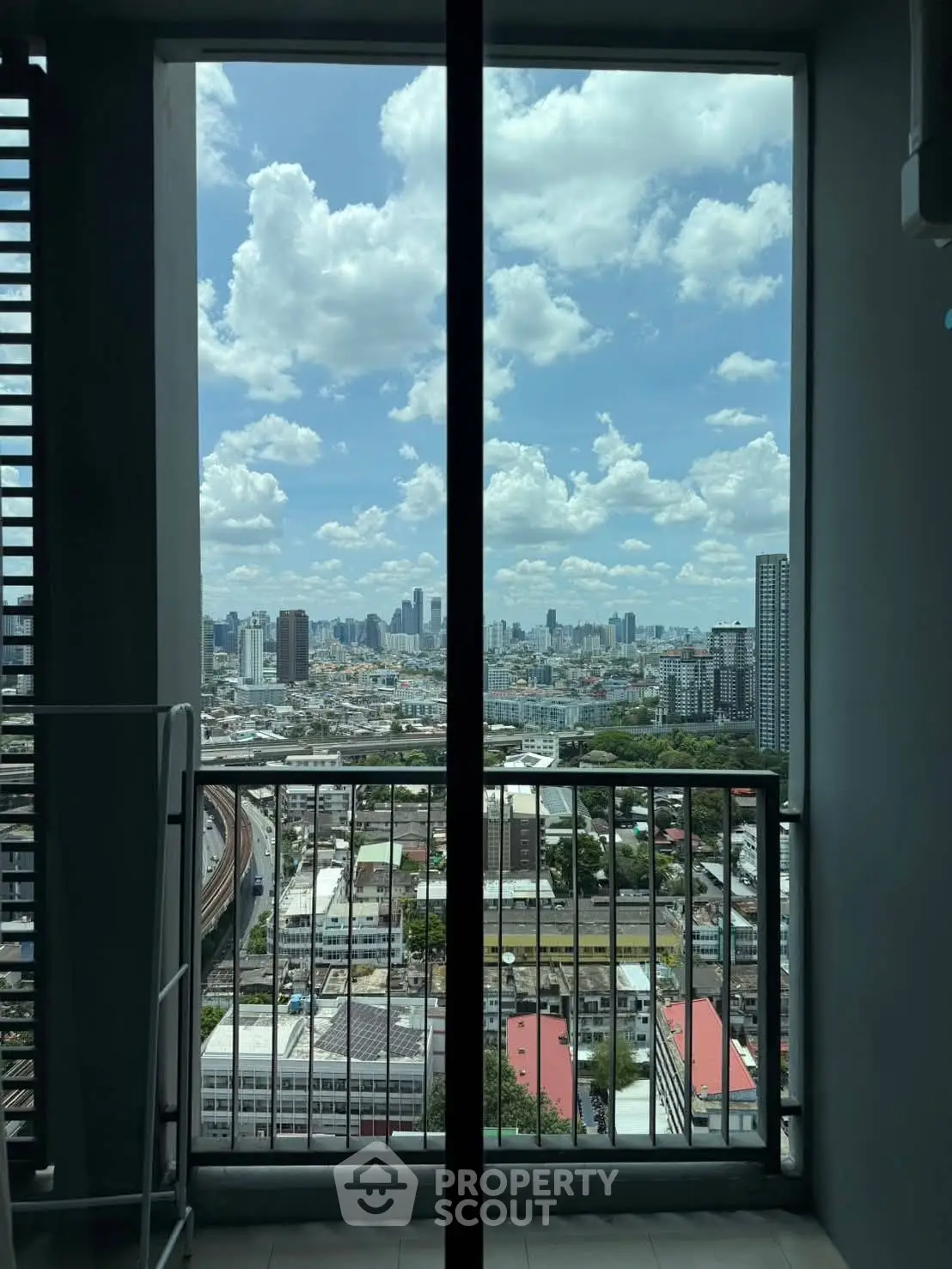 Stunning cityscape view from a high-rise balcony, perfect for urban living.