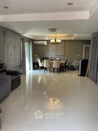 Spacious living room with elegant dining area and modern decor