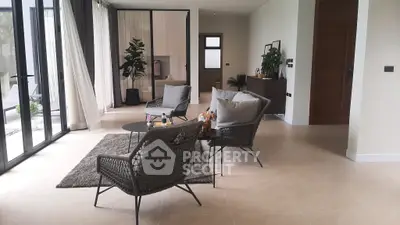 Spacious modern living room with elegant furniture and large windows