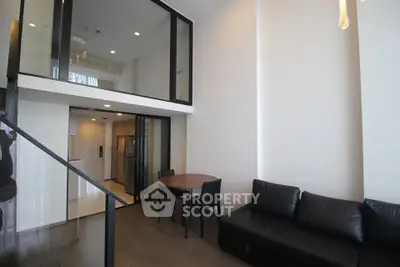 Modern duplex apartment with sleek interior design and high ceilings
