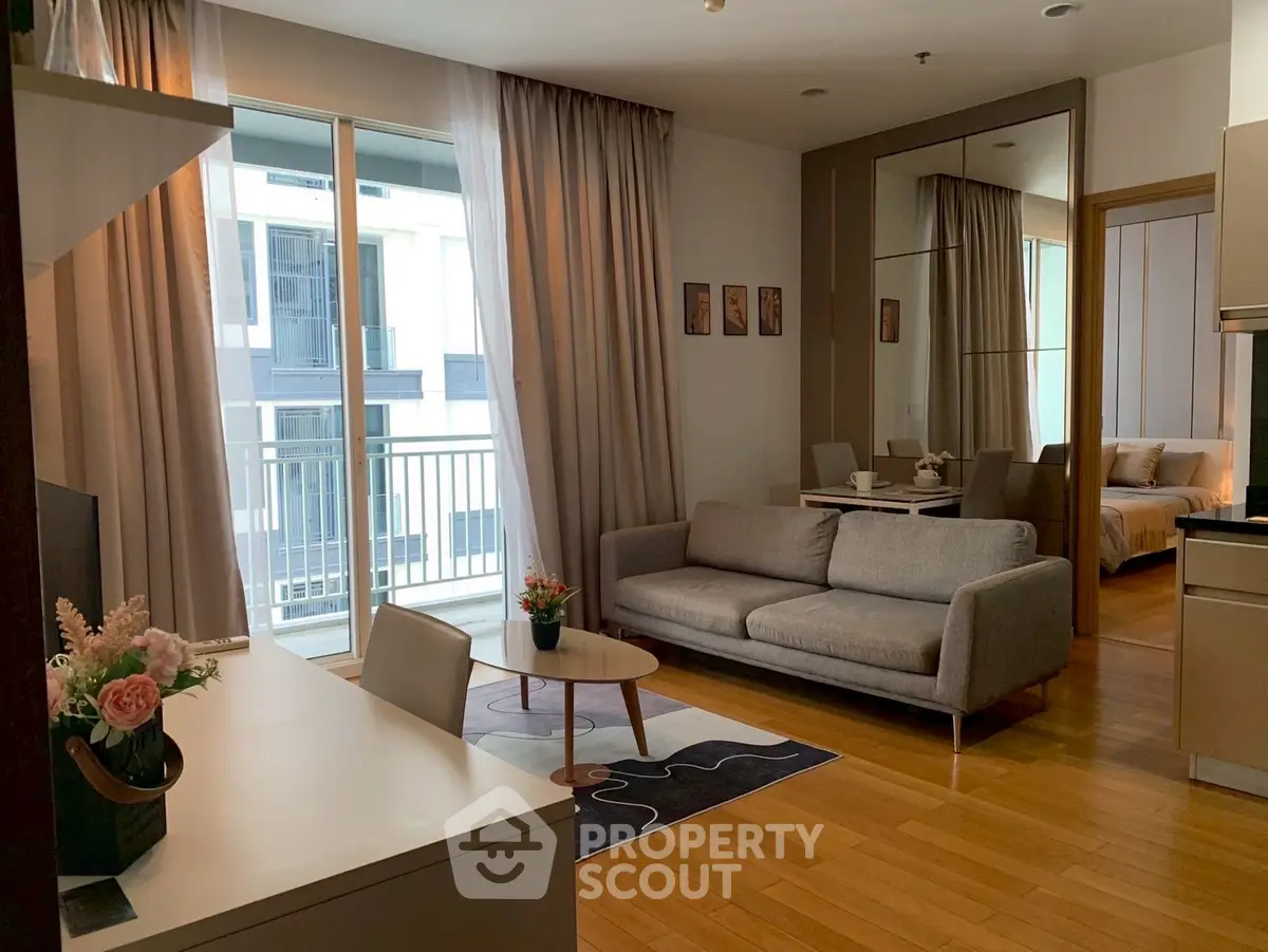 Modern living room with cozy sofa and balcony view in stylish apartment