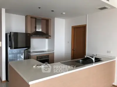 Modern kitchen with sleek appliances and open layout design