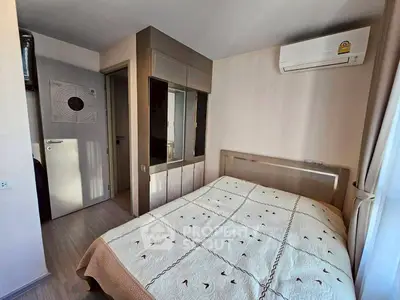 Cozy bedroom with modern air conditioning and stylish decor, perfect for comfort and relaxation.