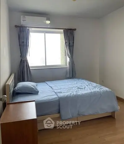 Cozy bedroom with natural light and modern furnishings