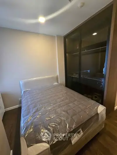 Modern bedroom with sleek design and ample storage space