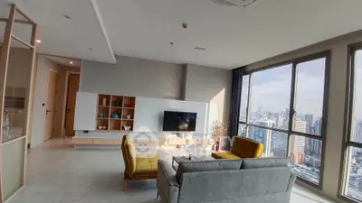 Modern living room with panoramic city view and stylish furniture