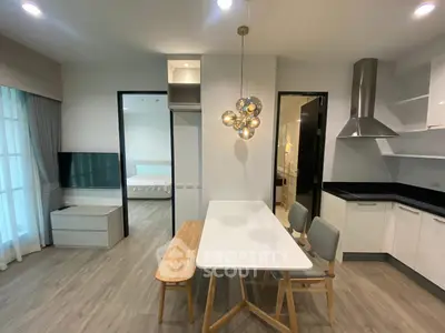 Modern open-plan living space with stylish kitchen and dining area