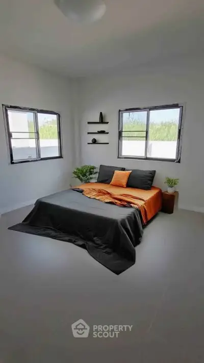Modern bedroom with stylish decor and natural light