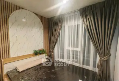 Modern living room with stylish decor and large windows offering a stunning view.