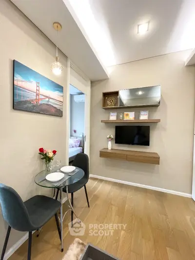 Chic modern living room with stylish decor and cozy dining area, perfect for urban living.