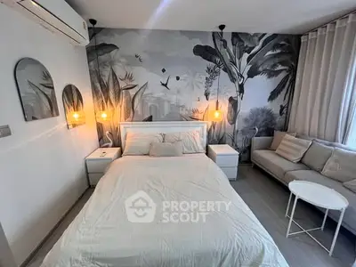 Modern bedroom with stylish decor and cozy seating area