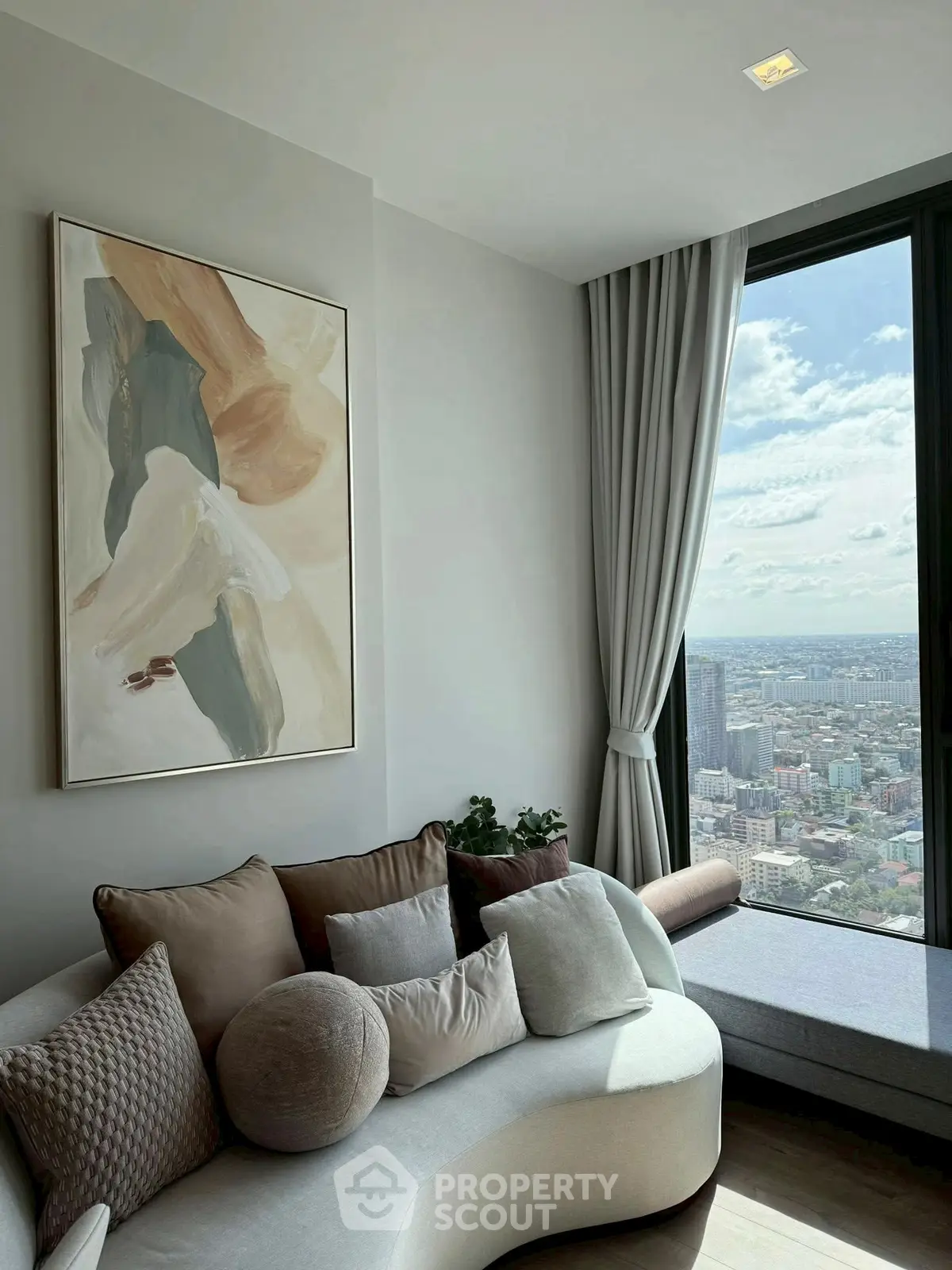 Modern living room with stylish sofa and panoramic city view
