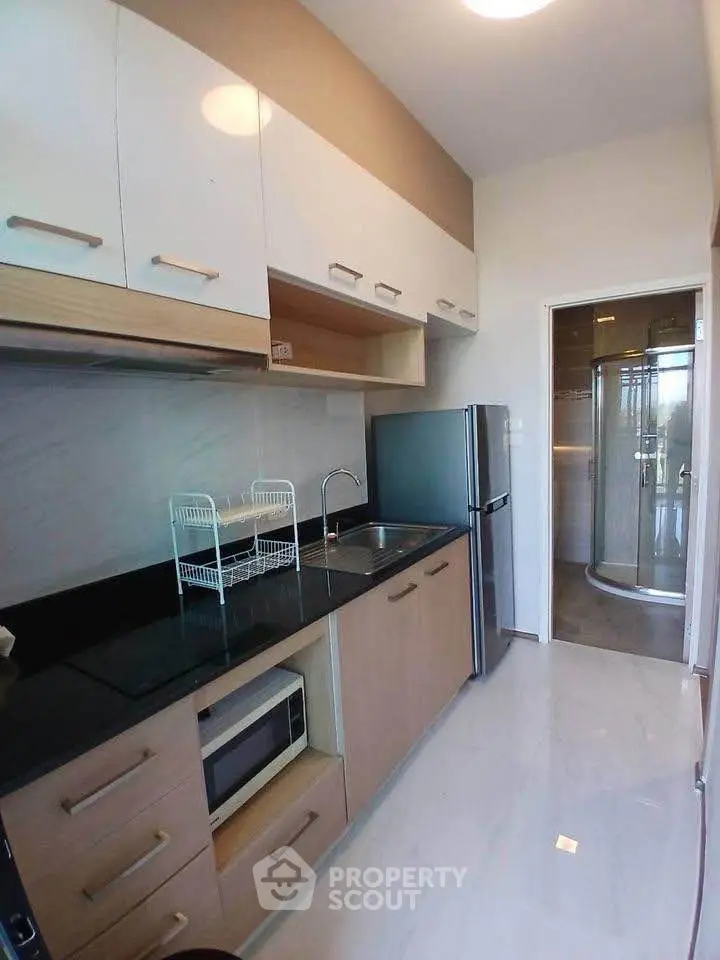 Modern kitchen with sleek cabinets and stainless steel appliances