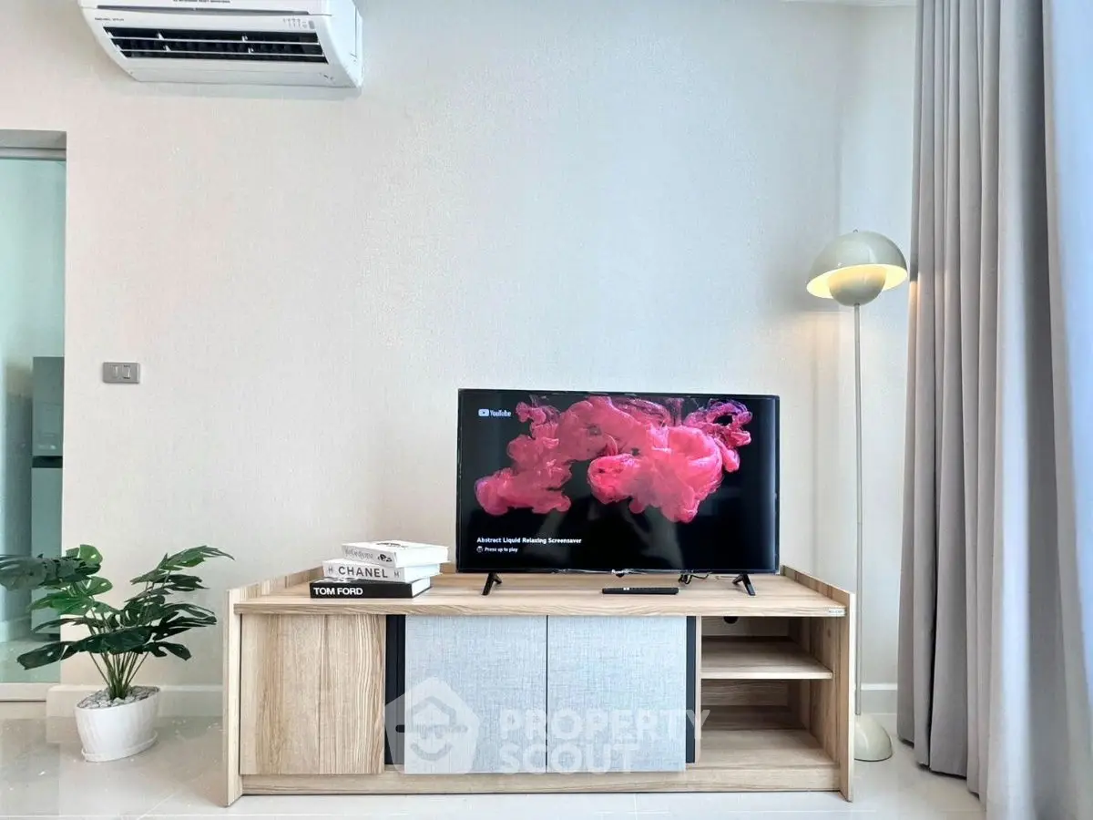 Modern living room with stylish TV stand and air conditioning