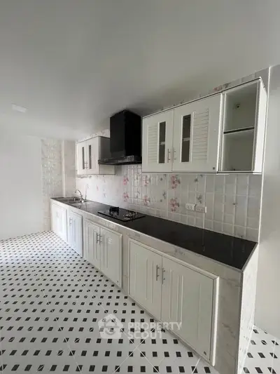 Modern kitchen with sleek cabinetry and gas stove in stylish apartment