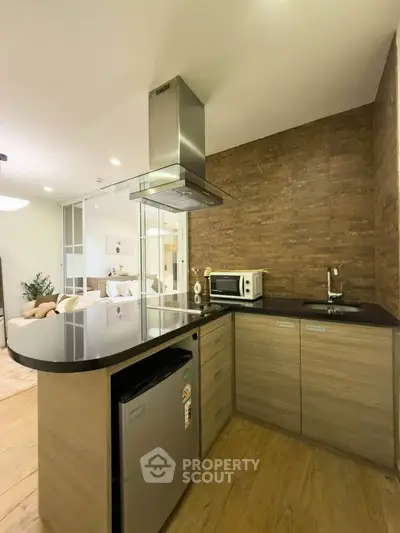 Modern kitchen with sleek design, featuring stainless steel appliances and open layout for seamless living.