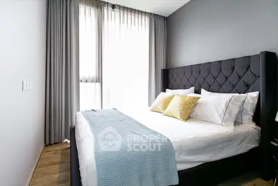 Modern bedroom with elegant decor and natural light