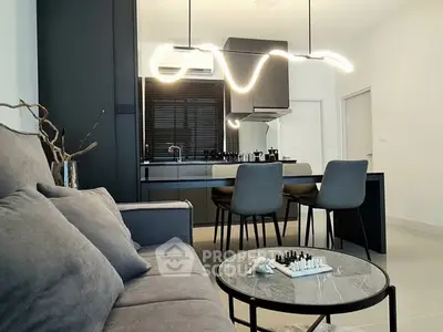 Modern living room with stylish lighting and cozy seating area.