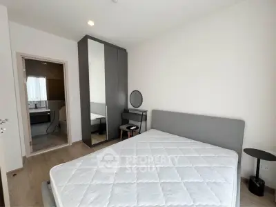 Modern bedroom with ensuite bathroom and sleek furniture design