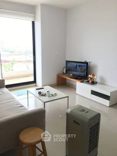 Modern living room with large window and minimalist decor