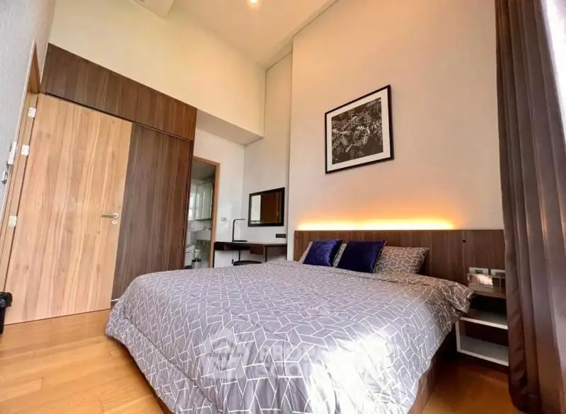 Spacious modern bedroom with elegant decor and natural light