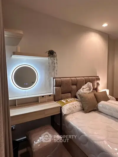 Cozy bedroom with modern decor and illuminated mirror