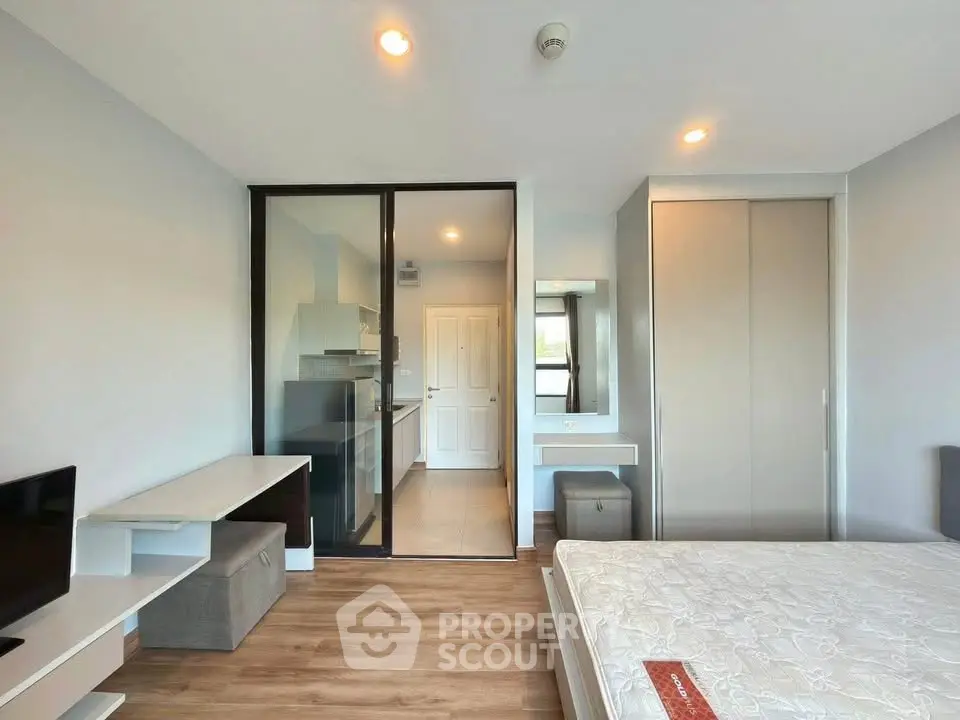 Modern bedroom with open kitchen layout and stylish decor