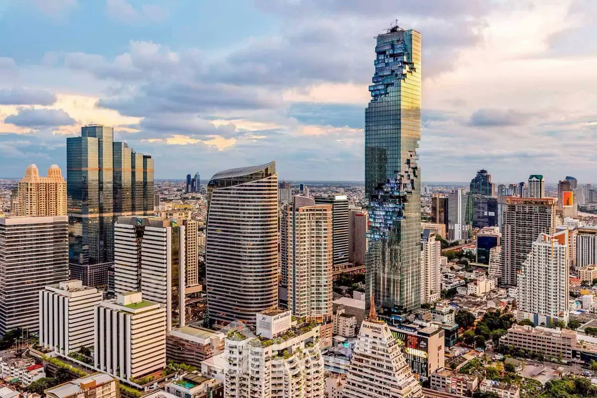 Stunning skyline view of modern skyscrapers in a bustling city center at sunset.