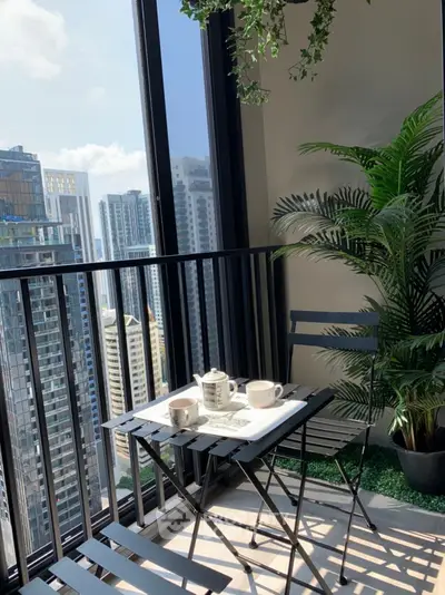 Chic urban balcony with city skyline view, perfect for morning coffee or relaxing afternoons.