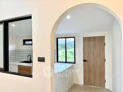 Modern kitchen with open layout and scenic window view