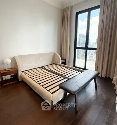 Spacious bedroom with city view and modern furnishings