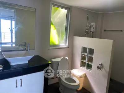 Modern bathroom with sleek fixtures and natural light