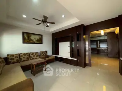 Spacious living room with elegant furniture and modern ceiling fan