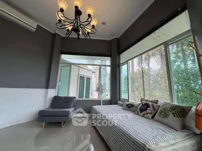 Spacious living room with large windows and modern decor