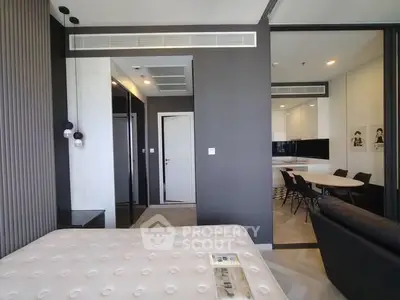 Modern apartment interior with stylish bedroom and open kitchen layout