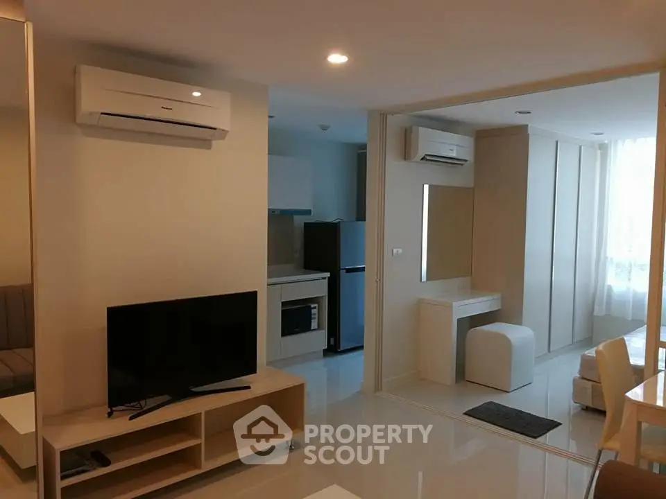 Modern living room with air conditioning and sleek furniture in a stylish apartment.