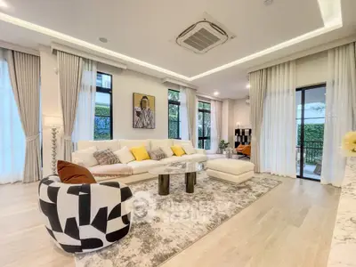 Luxurious modern living room with elegant decor and large windows