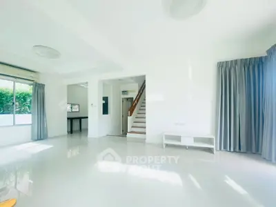 Spacious and bright living room with modern design and large windows