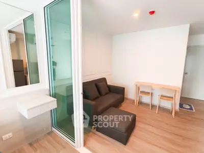 Modern living room with sleek design and cozy furniture in a stylish apartment.