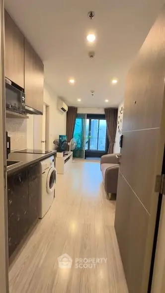 Modern apartment interior with open layout and balcony view