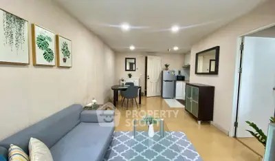 Modern living room with stylish decor and open kitchen layout